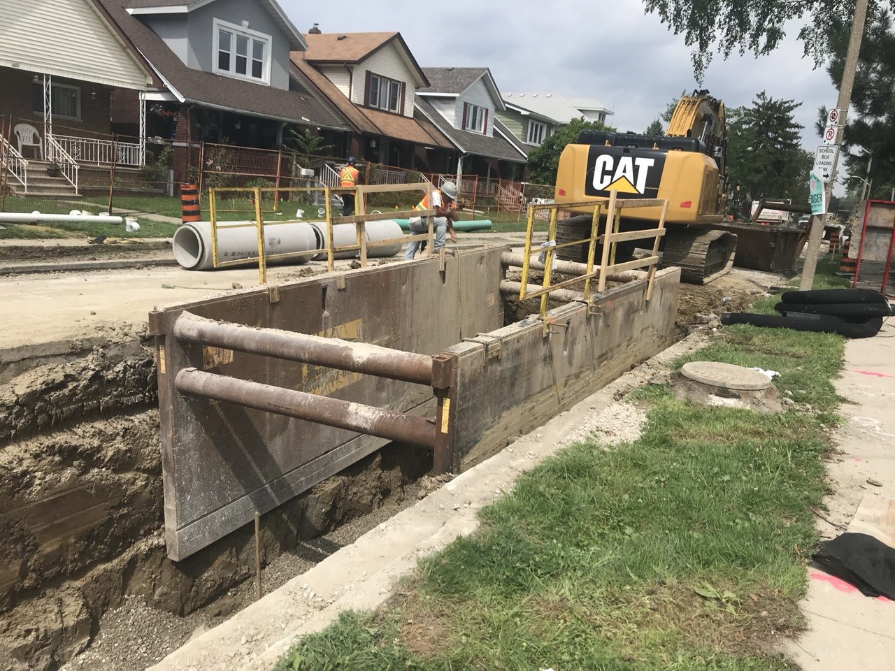 Trench shoring with CAT equipment